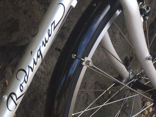 White Rodriguez touring bicycle with black script decal