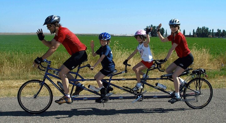 4 person bike that converts to triple or double bike with family riding it