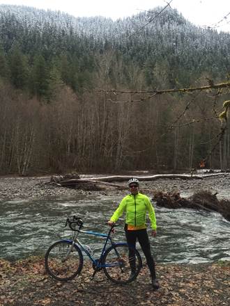 Mike by the river showing off is Rainier road bike