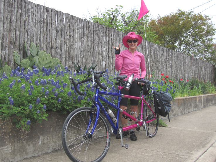 Mary on the tandem, wearing a pink cowboy hat